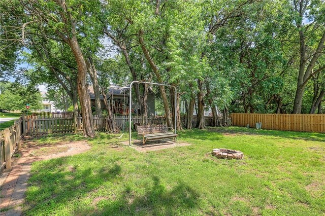 14001 S Tomahawk Dr, Olathe, KS 66062 - fenced backyard featuring a fire pit