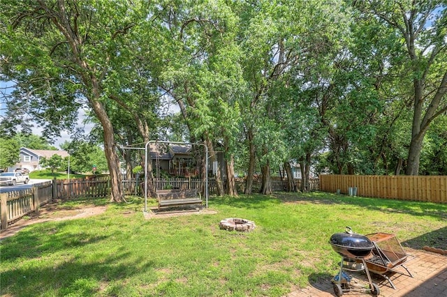 14001 S Tomahawk Dr, Olathe, KS 66062 - fenced backyard with an outdoor fire pit