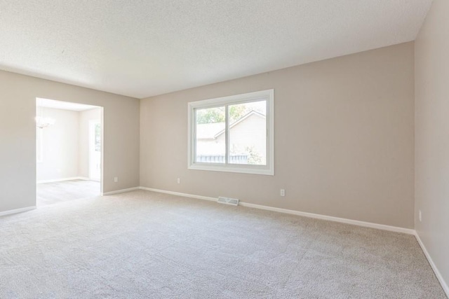 105 S W St, Concordia, MO 64020 - empty room with light carpet and a textured ceiling