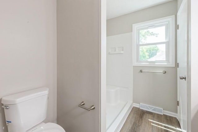 105 S W St, Concordia, MO 64020 - full bath with wood finished floors and a shower stall