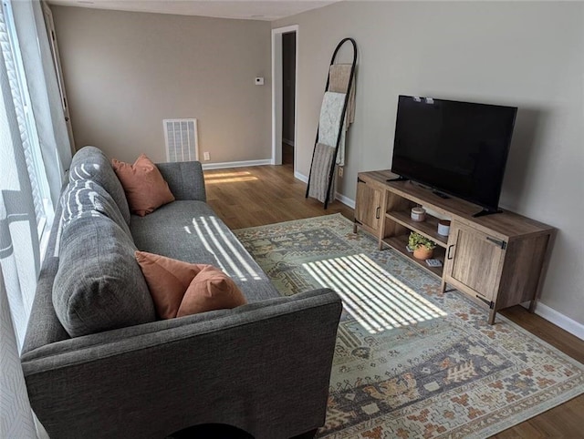8804 E 47th St, Kansas City, MO 64129 - living area featuring wood finished floors and baseboards