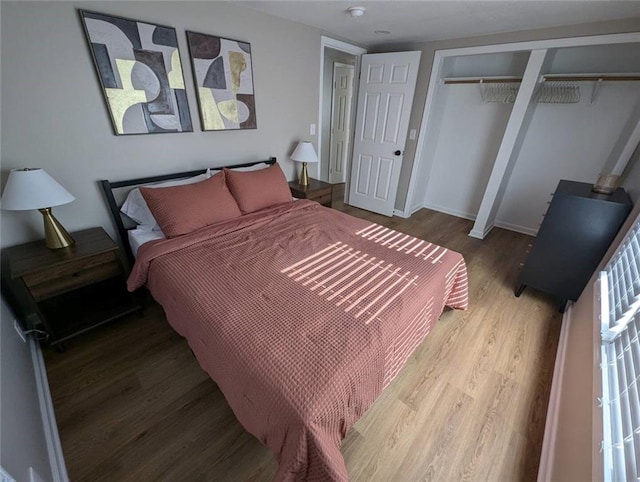 8804 E 47th St, Kansas City, MO 64129 - bedroom featuring wood finished floors and baseboards