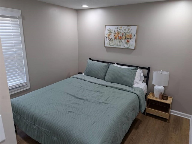 8804 E 47th St, Kansas City, MO 64129 - bedroom with wood finished floors, recessed lighting, and baseboards
