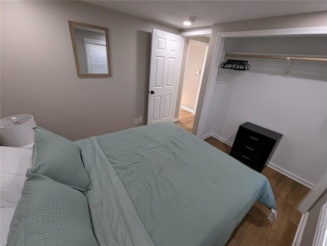 8804 E 47th St, Kansas City, MO 64129 - bedroom with wood finished floors and baseboards