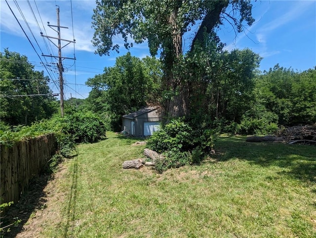 8804 E 47th St, Kansas City, MO 64129 - view of yard featuring a garage