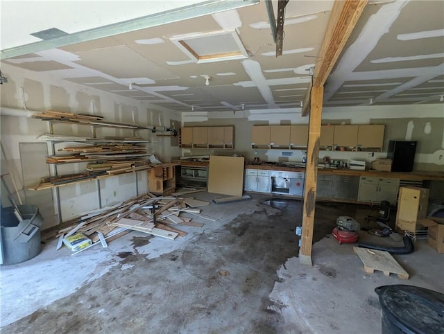 8804 E 47th St, Kansas City, MO 64129 - garage featuring a workshop area