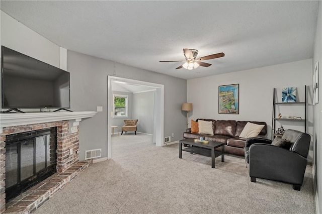 604 NE Ash St NE, Lees Summit, MO 64063 - carpeted living area with a ceiling fan, a brick fireplace, and baseboards