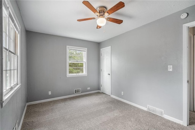 604 NE Ash St NE, Lees Summit, MO 64063 - carpeted empty room featuring ceiling fan, baseboards, and a smoke detector