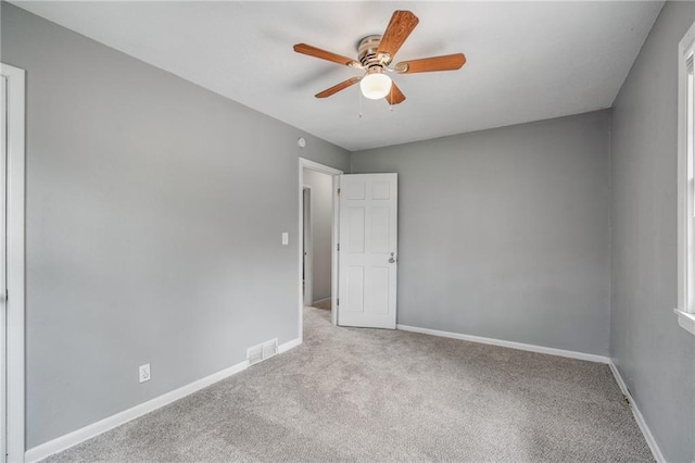 604 NE Ash St NE, Lees Summit, MO 64063 - carpeted spare room with a ceiling fan and baseboards