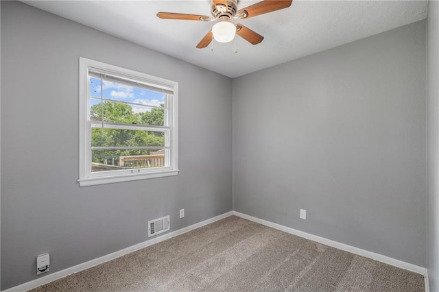 604 NE Ash St NE, Lees Summit, MO 64063 - carpeted spare room with baseboards and a ceiling fan