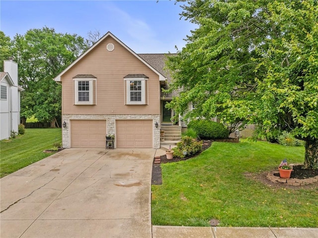 1229 SE Princeton Dr, Lees Summit, MO 64081 - view of front of property with a garage, driveway, a front lawn, and stone siding