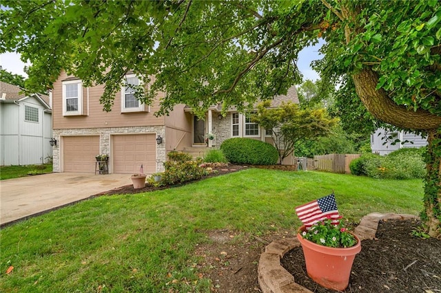 1229 SE Princeton Dr, Lees Summit, MO 64081 - view of front facade with stone siding, an attached garage, and driveway