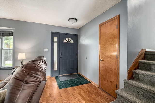 1229 SE Princeton Dr, Lees Summit, MO 64081 - foyer with stairway and wood finished floors