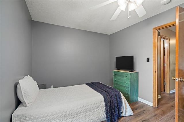 1229 SE Princeton Dr, Lees Summit, MO 64081 - bedroom with wood finished floors and a ceiling fan