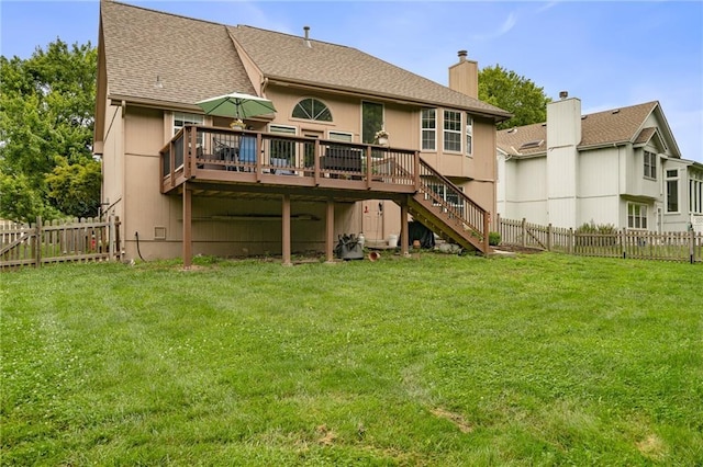 1229 SE Princeton Dr, Lees Summit, MO 64081 - back of property with a wooden deck, stairs, a fenced backyard, and a chimney