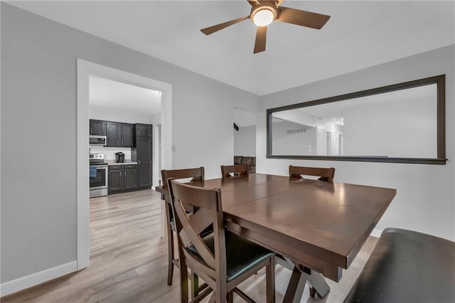 19133 E 15th St N, Independence, MO 64056 - dining area with light wood finished floors, ceiling fan, and baseboards
