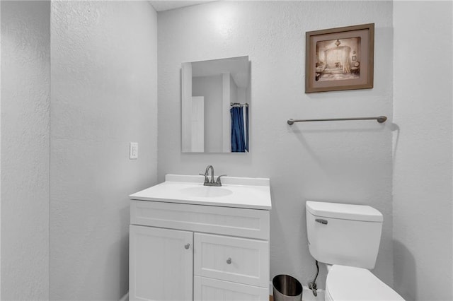 19133 E 15th St N, Independence, MO 64056 - full bath with toilet, vanity, and a textured wall