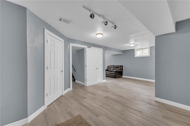 19133 E 15th St N, Independence, MO 64056 - basement featuring wood finished floors, baseboards, and rail lighting