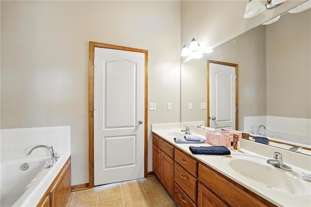 614 SW Tisha Ln, Grain Valley, MO 64029 - bathroom with double vanity, a bath, and tile patterned floors