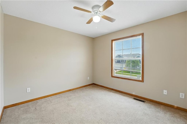 614 SW Tisha Ln, Grain Valley, MO 64029 - empty room with carpet and a ceiling fan