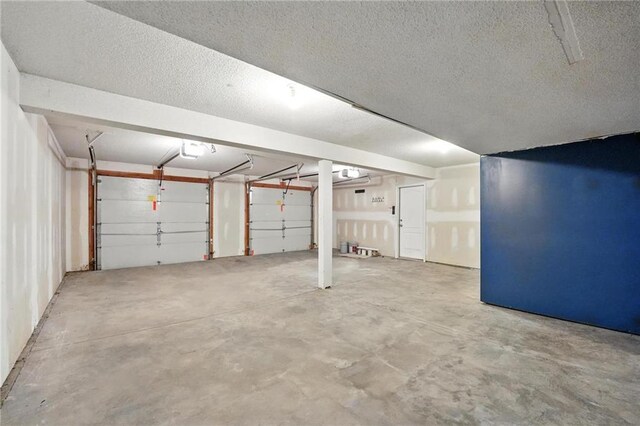 614 SW Tisha Ln, Grain Valley, MO 64029 - garage featuring a garage door opener