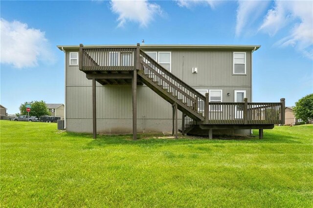 614 SW Tisha Ln, Grain Valley, MO 64029 - rear view of property with a deck, a yard, and stairs