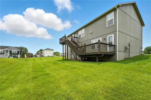 614 SW Tisha Ln, Grain Valley, MO 64029 - rear view of house with a deck and a lawn