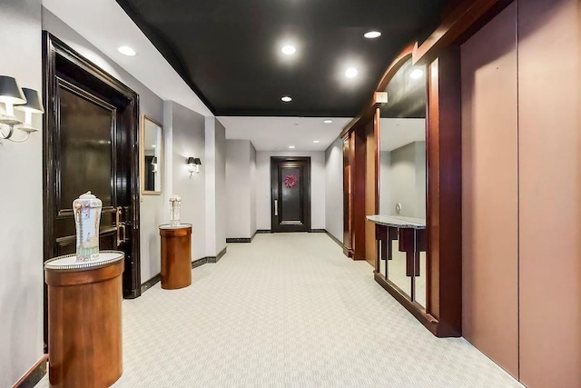 400 W 49th Ter Unit 2106, Kansas City, MO 64112 - hallway with light colored carpet, recessed lighting, and baseboards