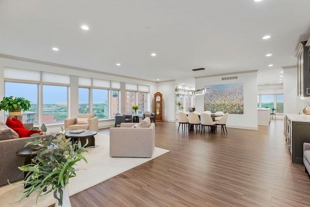 400 W 49th Ter Unit 2106, Kansas City, MO 64112 - living area with wood finished floors, recessed lighting, and baseboards