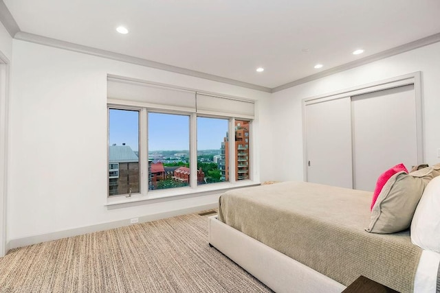 400 W 49th Ter Unit 2106, Kansas City, MO 64112 - bedroom with recessed lighting, a closet, carpet, baseboards, and ornamental molding