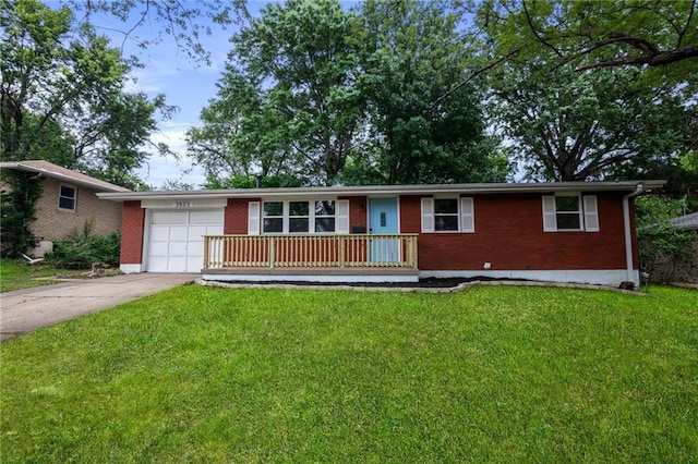 3523 Drumm Ave, Independence, MO 64055 - single story home featuring brick siding, driveway, a garage, and a front lawn