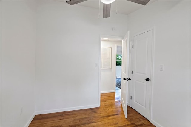 3523 Drumm Ave, Independence, MO 64055 - unfurnished room with wood finished floors, a ceiling fan, and baseboards
