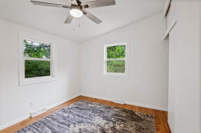 3523 Drumm Ave, Independence, MO 64055 - empty room with vaulted ceiling, wood finished floors, ceiling fan, and baseboards