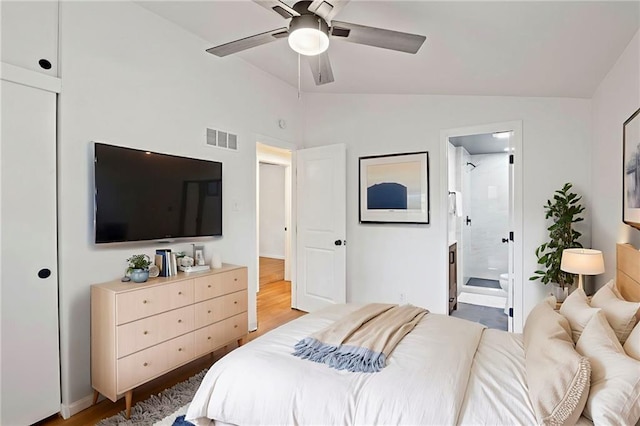 3523 Drumm Ave, Independence, MO 64055 - bedroom with vaulted ceiling, wood finished floors, connected bathroom, and ceiling fan