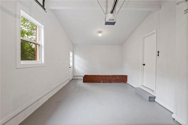 3523 Drumm Ave, Independence, MO 64055 - garage featuring a garage door opener and baseboards