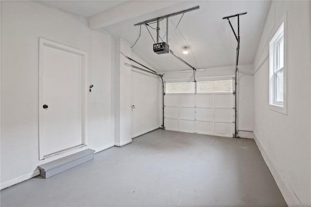 3523 Drumm Ave, Independence, MO 64055 - garage with a garage door opener and baseboards