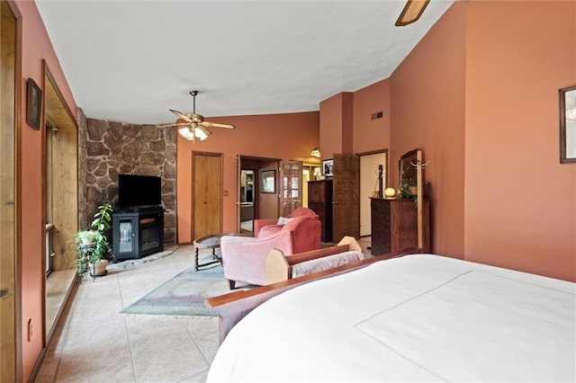 19913 Pepper Tree Rd, Edgerton, KS 66021 - bedroom with a fireplace, vaulted ceiling, a ceiling fan, and light tile patterned floors