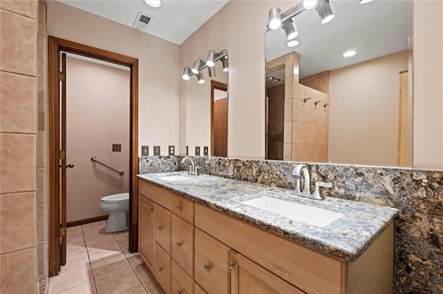 19913 Pepper Tree Rd, Edgerton, KS 66021 - bathroom with double vanity, tile patterned flooring, and tiled shower