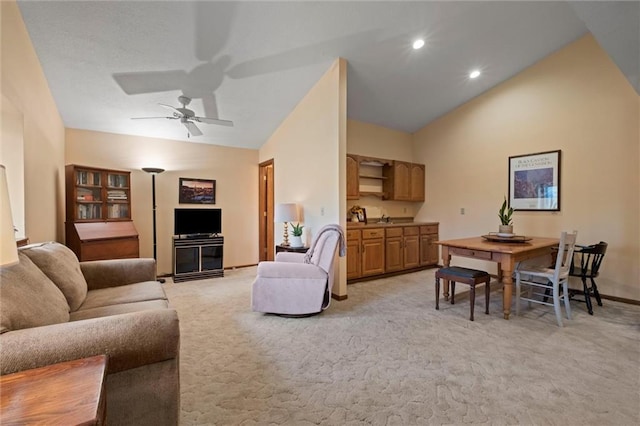 19913 Pepper Tree Rd, Edgerton, KS 66021 - living area featuring lofted ceiling, light carpet, a ceiling fan, and recessed lighting