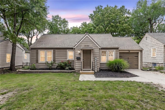 8424 Ward Parkway Plz, Kansas City, MO 64114 - view of front of property with an attached garage, concrete driveway, a front lawn, and roof with shingles