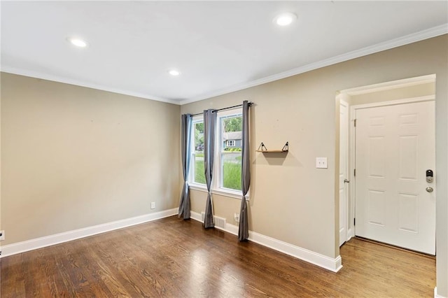 8424 Ward Parkway Plz, Kansas City, MO 64114 - foyer entrance featuring wood finished floors, crown molding, and recessed lighting