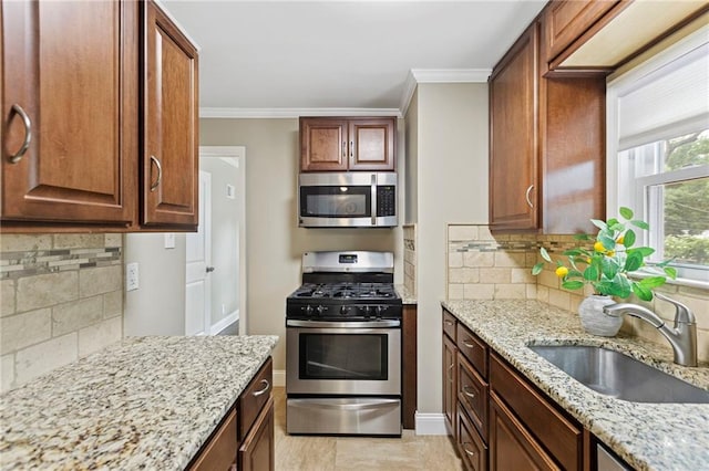 8424 Ward Parkway Plz, Kansas City, MO 64114 - kitchen with appliances with stainless steel finishes, backsplash, light stone countertops, and crown molding