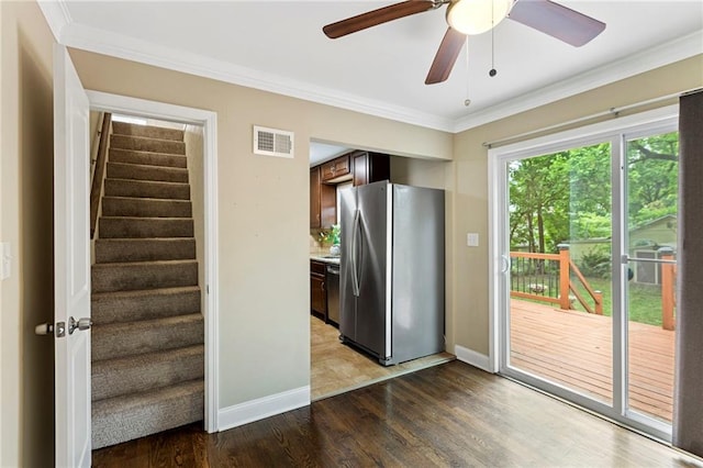 8424 Ward Parkway Plz, Kansas City, MO 64114 - kitchen with appliances with stainless steel finishes, wood finished floors, ornamental molding, ceiling fan, and light countertops