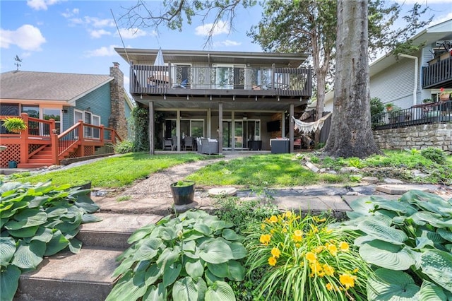 37 Beach Dr, Blue Springs, MO 64015 - rear view of house featuring a deck, a yard, and stairs