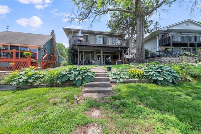 37 Beach Dr, Blue Springs, MO 64015 - back of house featuring a lawn and a wooden deck