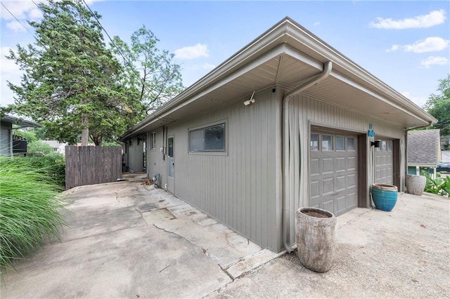 37 Beach Dr, Blue Springs, MO 64015 - view of side of home with a garage and driveway