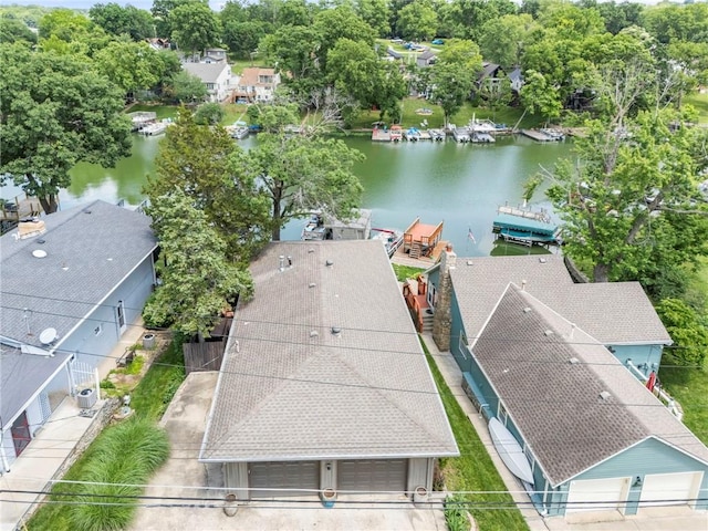 37 Beach Dr, Blue Springs, MO 64015 - aerial view of residential area with a large body of water and a tree filled landscape