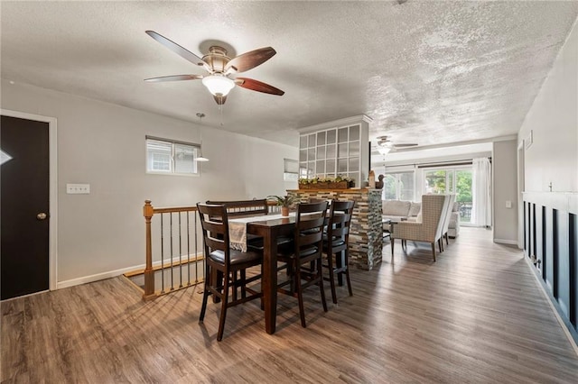 37 Beach Dr, Blue Springs, MO 64015 - dining room with ceiling fan, wood finished floors, a textured ceiling, and baseboards