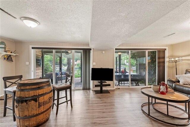 37 Beach Dr, Blue Springs, MO 64015 - living area featuring a textured ceiling and wood finished floors