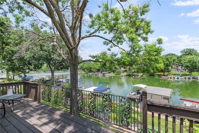 37 Beach Dr, Blue Springs, MO 64015 - deck featuring a water view and view of wooded area